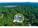 Lovely neighborhood aerial view, showcasing the property's location within lush greenery and near nearby homes at 3402 Devoe Ct, Marietta, GA 30062
