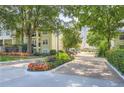The Habersham of Buckhead entrance showcasing mature trees, beautiful landscaping, and a paved brick entrance road at 3655 Habersham Ne Rd # 344, Atlanta, GA 30305