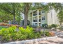 Lush landscaping surrounds this Habersham of Buckhead private residence with beautiful flowering plants and mature trees at 3655 Habersham Ne Rd # 344, Atlanta, GA 30305
