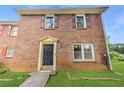 Close up of charming brick home with classic front door, providing a welcoming entrance at 4691 Shumate Dr, Stone Mountain, GA 30083