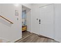 Inviting entryway featuring sleek wood-look flooring and neutral decor, creating a modern aesthetic at 4691 Shumate Dr, Stone Mountain, GA 30083
