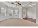 Spacious living room with decorative ceilings, large windows, and an open layout to other living spaces at 1354 Slate Bend Dr, Dacula, GA 30019