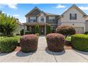 Charming two-story home with lush front yard landscaping and inviting walkway at 2602 Corey Park Dr, Loganville, GA 30052