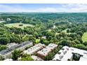 Aerial view overlooking the community, surrounded by parks and green spaces, offering a serene residential setting at 273 12Th Ne St # 111, Atlanta, GA 30309