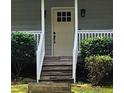 Close-up view of the home's front door, showcasing the welcoming entrance and details at 713 Trickum Valley Dr, Woodstock, GA 30188