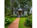 Attractive bungalow home with brick walkway and professionally landscaped yard at 1876 Madrona Street Nw St, Atlanta, GA 30318