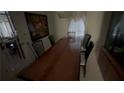 Cozy dining room with a long wooden table and chairs at 1095 Mitchell Crossing Sw Dr, Atlanta, GA 30331