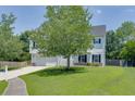 Beautiful two-story home with green lawn and mature trees at 3153 Morgan Box Ne Ln, Buford, GA 30519