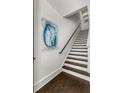 Stylish staircase with hardwood floors and elegant decor at 304 Stonemont Dr, Atlanta, GA 30305