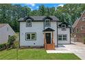 Beautiful two-story home with a well-maintained lawn and a contemporary design at 656 S Elizabeth Nw Pl, Atlanta, GA 30318