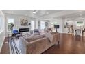 Bright and airy living room featuring a fireplace, hardwood floors, and an open layout to the dining and kitchen areas at 656 S Elizabeth Nw Pl, Atlanta, GA 30318