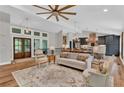 Bright living room with vaulted ceilings, hardwood floors, and an open floor plan at 230 Thistlewood Ln, Roswell, GA 30075