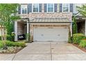 Beautiful townhome features a two-car garage, and lovely landscaping at 4486 Huffman Drive Ne Dr, Roswell, GA 30075