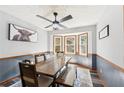 Cozy dining room with bay windows, wood floors, and a rustic table and bench, ideal for Gathering meals at 202 Cedar Valley Ct, Canton, GA 30115