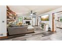 Inviting living room featuring wood floors, a charming fireplace, and a stylish accent wall for a modern touch at 202 Cedar Valley Ct, Canton, GA 30115