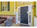 Inviting front door with sidelights and a decorative 'Hey Friends' sign at 60 Boardwalk Ave, Covington, GA 30016