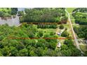 Lush wooded property with lake access, outlined in orange, with a home, and plenty of trees at 901 N Van Wert N Rd, Villa Rica, GA 30180