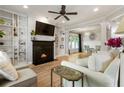 Bright living room featuring a fireplace, built-in bookshelves, and hardwood flooring at 2238 Parkview Nw Ct, Atlanta, GA 30318