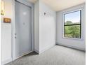 Entry to apartment with carpeted floors, window, and trim at 425 Chapel Sw St # 1211, Atlanta, GA 30313