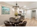 Cozy dining area featuring hardwood floors, a chandelier, and a window that provides natural light at 2775 Belleau Se Ln, Atlanta, GA 30316