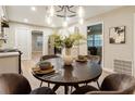 Charming dining room with a stylish chandelier, seating for four, and easy access to the kitchen at 2775 Belleau Se Ln, Atlanta, GA 30316