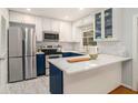 Modern kitchen with stainless steel appliances, white cabinets, subway tile backsplash, and marble countertop at 1101 Collier Nw Rd # K5, Atlanta, GA 30318