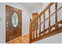 Inviting foyer with wood floors, a decorative front door, and a staircase at 786 Mitsy Pt, Marietta, GA 30068