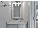 Clean and bright bathroom featuring a modern vanity with stone countertop at 3686 Claredun Ct, Cumming, GA 30040