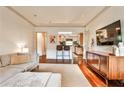 Open living room with seamless transition to the kitchen and hardwood flooring at 55 Delmont Ne Dr # C3, Atlanta, GA 30305