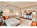 Bright living room featuring hardwood floors and an open layout to the kitchen at 55 Delmont Ne Dr # C3, Atlanta, GA 30305