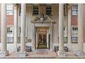 Elegant building entrance featuring columns, detailed stonework, and benches at 30 5Th Ne St # 1010, Atlanta, GA 30308