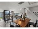 Modern dining area with an open floor plan and expansive city views at 30 5Th Ne St # 1010, Atlanta, GA 30308