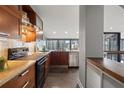 Stylish kitchen featuring stainless steel appliances and a window overlooking the cityscape at 30 5Th Ne St # 1010, Atlanta, GA 30308