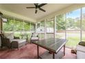 Relaxing screened porch with comfortable seating, perfect for enjoying the outdoors at 5709 Center Hill Church Rd, Loganville, GA 30052