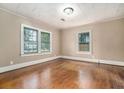 Spacious bedroom with hardwood floors and natural light from two windows at 724 Bellemeade Nw Ave, Atlanta, GA 30318