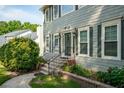 Elegant front entrance with a decorative door, beautiful landscaping, and inviting curb appeal at 740 Paris Dr, Lawrenceville, GA 30043