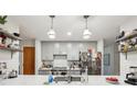 Well-appointed kitchen with ample counter space, modern appliances, and stylish pendant lighting at 2653 Partridge Trl, Duluth, GA 30097