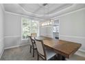 Formal dining room with classic trim and stylish lighting fixture at 4062 Brookside Pkwy, Decatur, GA 30034