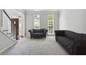 Bright and airy living room with neutral walls, carpet, and furnishings at 4062 Brookside Pkwy, Decatur, GA 30034