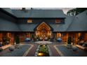 Magnificent courtyard boasts custom stonework, manicured greenery, and relaxing water feature at 114 Lees Lake Rd, Fayetteville, GA 30214