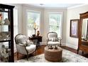 Comfortable living room with armchairs, and hardwood flooring at 4745 Belcrest Way, Cumming, GA 30040