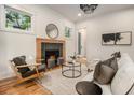 Bright living room featuring a decorative fireplace, modern lighting, and stylish furnishings at 50 Howell Se St # A, Atlanta, GA 30312