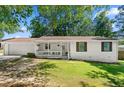 Charming single-story home with a covered porch and well-maintained lawn at 830 The Cir, Lawrenceville, GA 30043