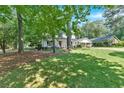 Traditional two-story home with lush green lawn and convenient covered parking space at 1406 Arden Sw Dr, Marietta, GA 30008