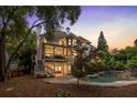 Stunning backyard features a screened porch, stone patio, and a tranquil private pool at 510 Northland Ridge Ct, Sandy Springs, GA 30342