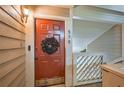 Inviting red front door with a decorative wreath; unit number 578 at 578 Mcgill Ne Pl # 578, Atlanta, GA 30312