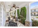 Inviting front porch with rocking chairs, ceiling fans and stone pillar accents at 1370 Dupont Nw Park, Atlanta, GA 30318