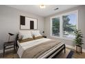 Well-lit bedroom featuring a cozy bed, stylish decor, and large windows at 901 Abernathy Rd # 2200, Sandy Springs, GA 30328