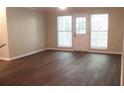 Bright living room has new flooring and sliding door access to the exterior at 3501 Shepherds Path, Decatur, GA 30034