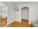 Bright entryway featuring hardwood floors, an arched doorway, and neutral decor at 1544 Brewer Sw Blvd, Atlanta, GA 30310